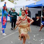 A member of the Federal Way High Schools Pacific Islander Club stars as the main dancer in the Taualuga dance. The group performed at the Taste of Federal Way event on Sept. 23, hosted by the Federal Way Farmers Market. The market celebrated its 20th year in 2023. (Photo by Keelin Everly-Lang / The Mirror)