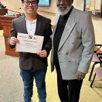 Photo by David Solano / City of Federal Way
Gabriel Cruz accepted an award for his essay from Diversity Commissioner Ron Walker for the Martin Luther King Jr. Day competition.