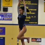 Todd Beamer gymnast twirls on the beam. Ben Ray / The Mirror