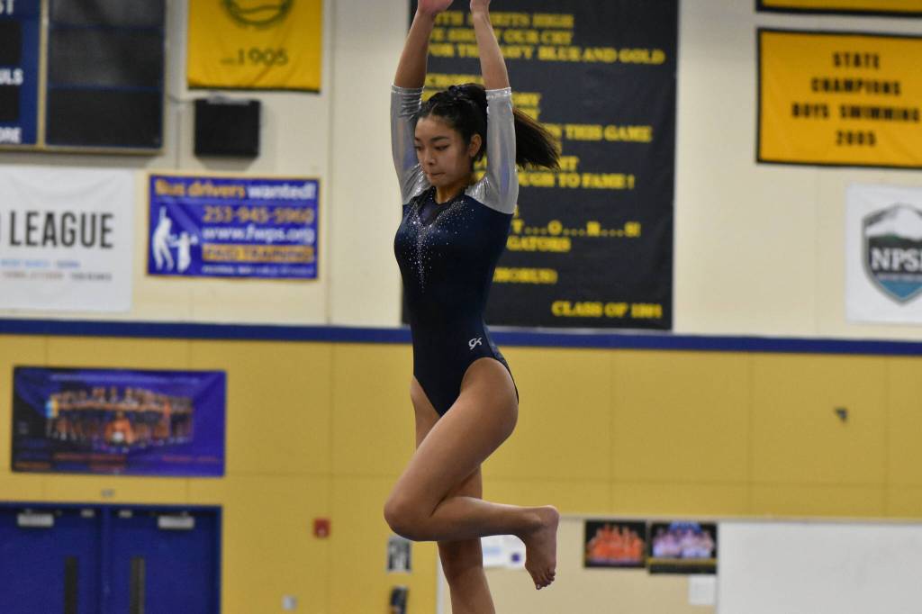 Todd Beamer gymnast twirls on the beam. Ben Ray / The Mirror