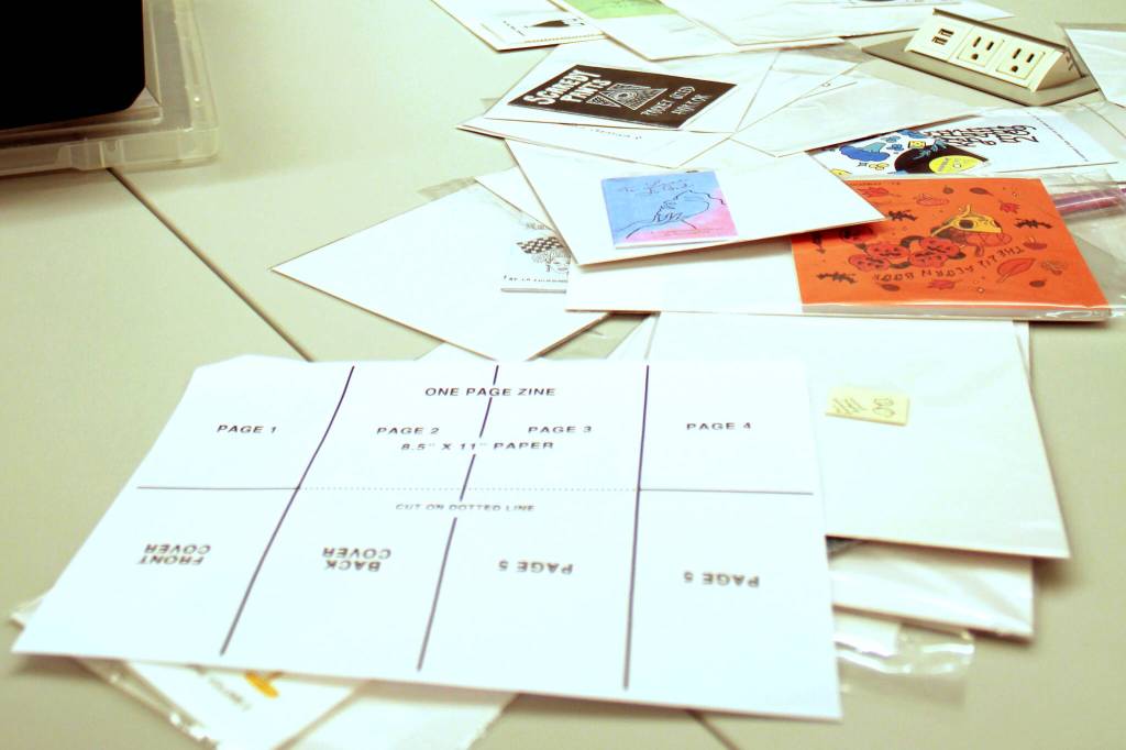 Photo by Keelin Everly-Lang / The Mirror
Instructions and zine examples litter the table at the zine making class at the Federal Way Library.