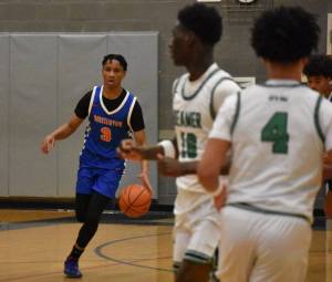 Photo by Ben Ray / Sound Publishing
Sebastian Arius of Auburn Mountainview dribbles through the Todd Beamer High School defense in a January game.