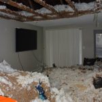 A resident at Miro Apartments arrived home to find her apartment covered in the insulation and ceiling detritus seen here. She has worked overtime to afford the furniture buried under the wreckage after fleeing a domestic violence situation. Photo by Keelin Everly-Lang / The Mirror.