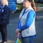 Elena Moscova listens to speakers at the raising of the Ukrainian flag at Federal Way City Hall on Friday, Feb. 23. (Photo by Keelin Everly-Lang / The Mirror)
