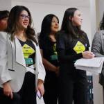 Jaqueline Garcia Castillo and her team at Mujer Al Volante watch Federal Way City Council candidates as the speak to voters at a forum on Wednesday. Photo by Keelin Everly-Lang / The Mirror
