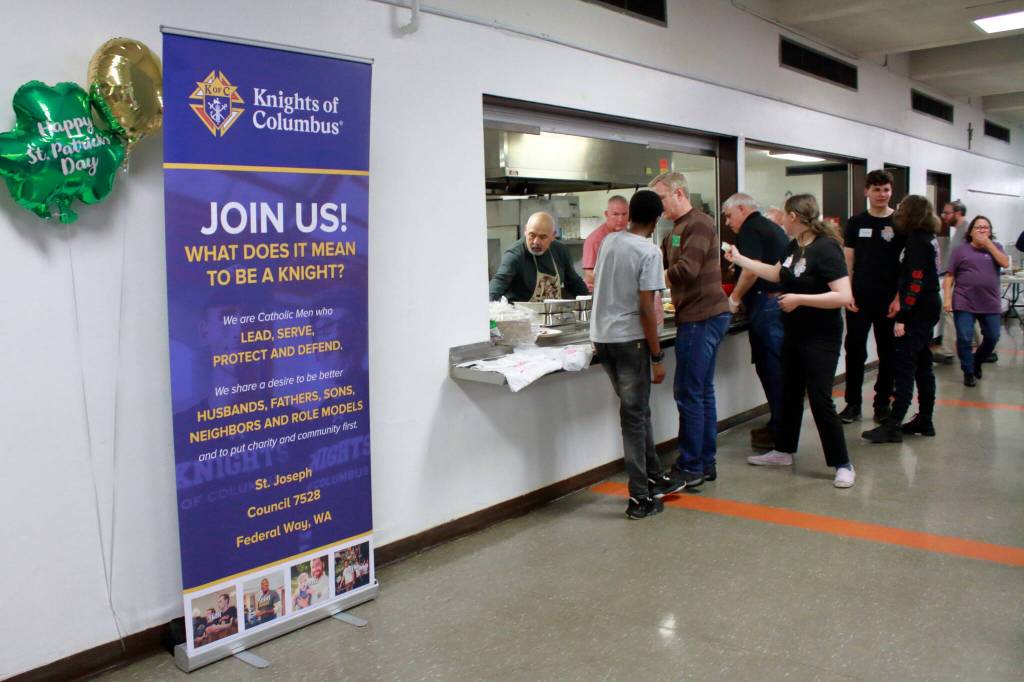 The local Knights of Columbus received recognition this year for recruiting members to join the service club in the form of this banner proudly displayed at the fish fry. Photo by Keelin Everly-Lang / The Mirror