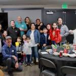 After three hours of food and conversation, guests and hosts of the Iftar dinner hosted at Veritas Church by the Al-Maidah Initiative pose together for a photo at the end of the evening. Photo by Keelin Everly-Lang / The Mirror
