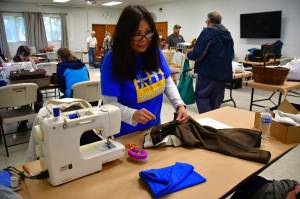 Sewing machines were available at Saturdays event to help mend clothing in need of repair. Photo by Bruce Honda