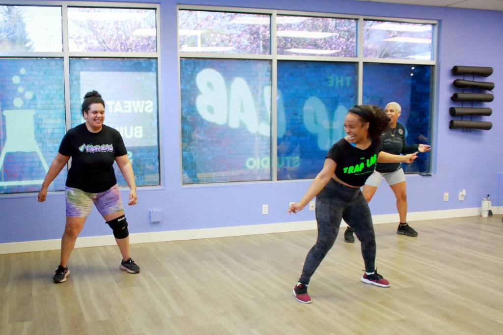 Class participants at the Tuesday night class at the Trap Lab in Federal Way cheer each other on. Photo by Keelin Everly-Lang / The Mirror