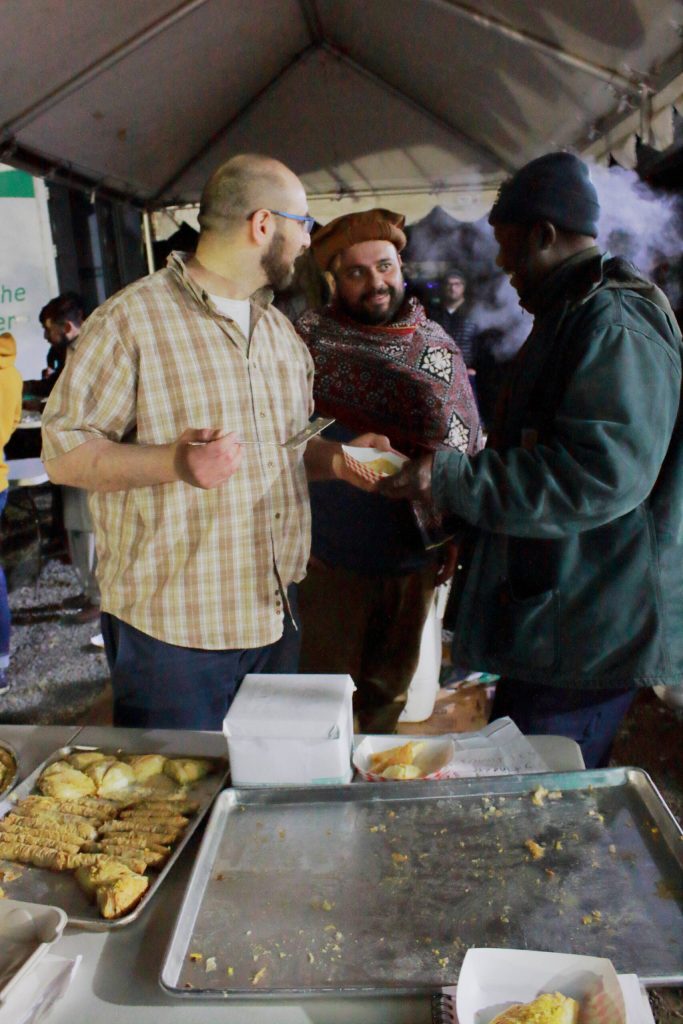 Kareem and Mohammed Ihsan talk baklava at the April 9 event at the Islamic Center of Federal Way. Photo by Keelin Everly-Lang / the Mirror.