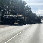 A military vehicle flipped on its side and blocked numerous northbound lanes of I-5 on Wednesday, April 10 near South 272nd Street. COURTESY PHOTO, Washington State Patrol