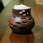 This candle holder is crafter from a single banksia seed pod from Australia, giving it the unique holes in its design. Photo by Keelin Everly-Lang / The Mirror