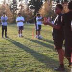 Rugby players in the U-14 group clap and cheer each other on after a teammate completes an impressive tackle at a recent practice. Photo by Keelin Everly-Lang / The Mirror