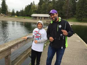 Participants fish from the dock at Steel Lake Park in Federal Way. File photo