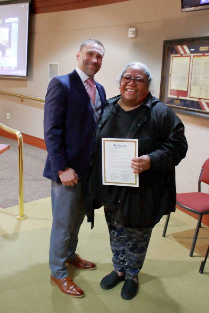 Councilmember Paul McDaniel presented the proclamation for Asian American, Native Hawaiian and Pacific Islander Heritage Month to Sili Savusa, Executive Director of the Pacif Islander Community Association of Washington. Photo by Keelin Everly-Lang / The Mirror