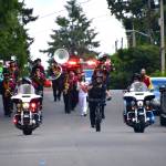 The Thomas Jefferson High School band, Federal Way Police Department motorcycle and bike patrol, Mayor Jim Ferrell, and Federal Way City Councilmembers Susan Honda and Jack Walsh joined the coaches and swim team captains in the annual Marine Hills Pool Opening Parade on May 18. Photos by Bruce Honda