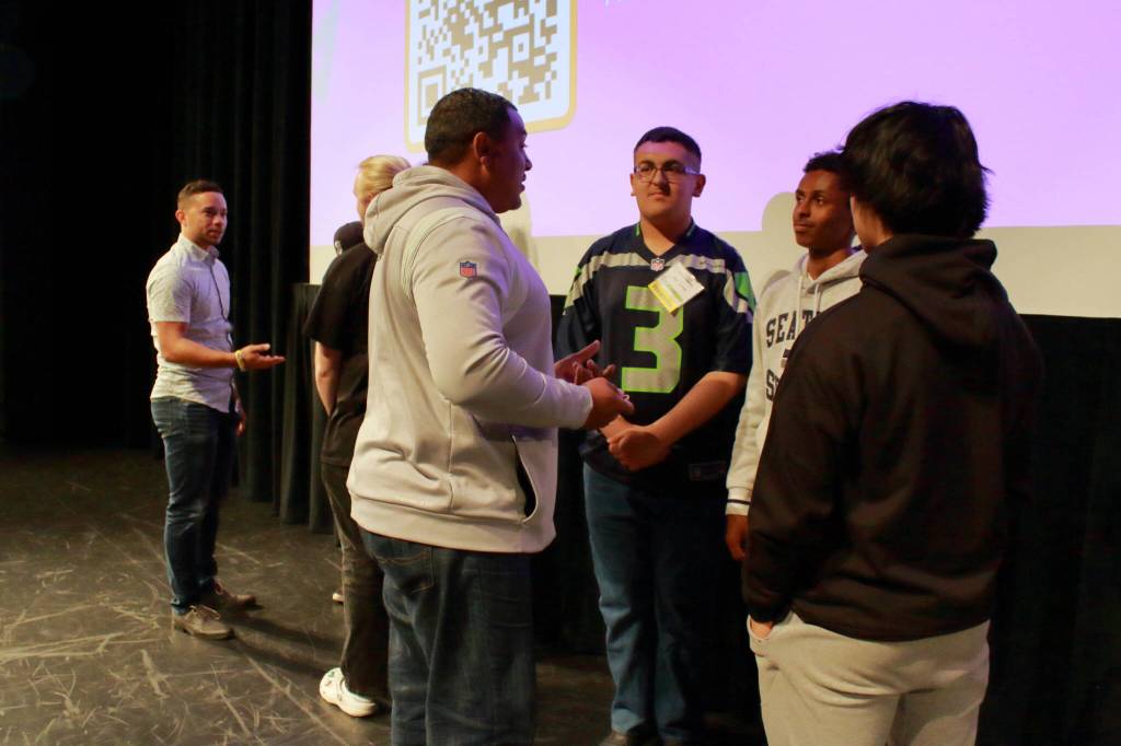 Judges talk with the students after the Final Pitch competition, sharing some last advice about how to get their business off the ground. Photo by Keelin Everly-Lang/The Mirror