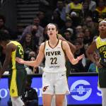 Caitlin Clark of the Indiana Fever shrugs as she looked for a foul on a three-point attempt in the fourth quarter against the Seattle Storm. Ben Ray / The Mirror