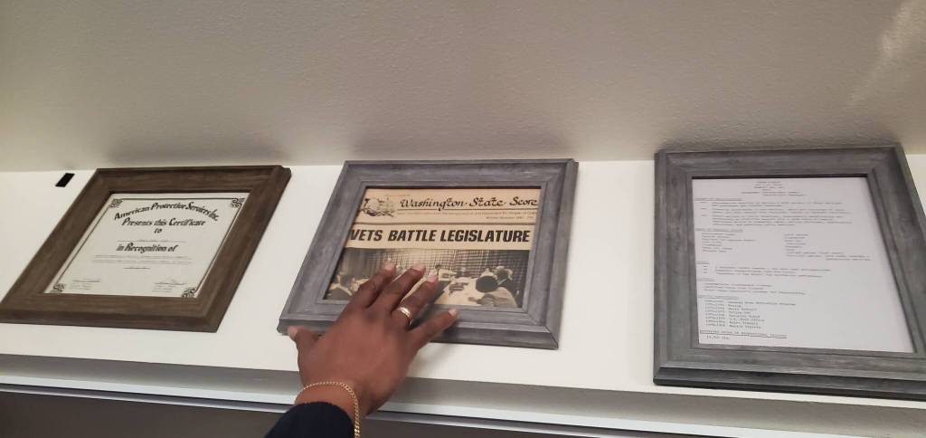 Frank Fields points to a newspaper clipping in his home documenting one of the causes he advocated for in his lifetime.