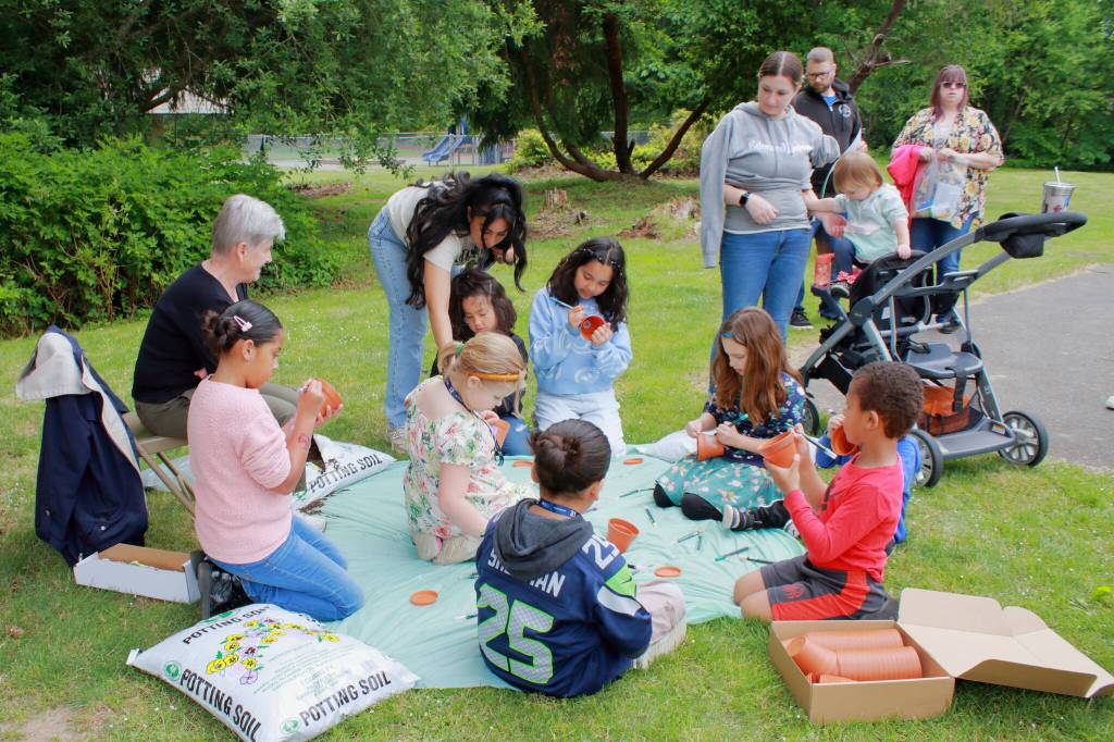 Decorating pots was just one of the many activities at the Twin Lakes Elementary community garden opening event on Saturday, June 1. Photo by Keelin Everly-Lang / The Mirror