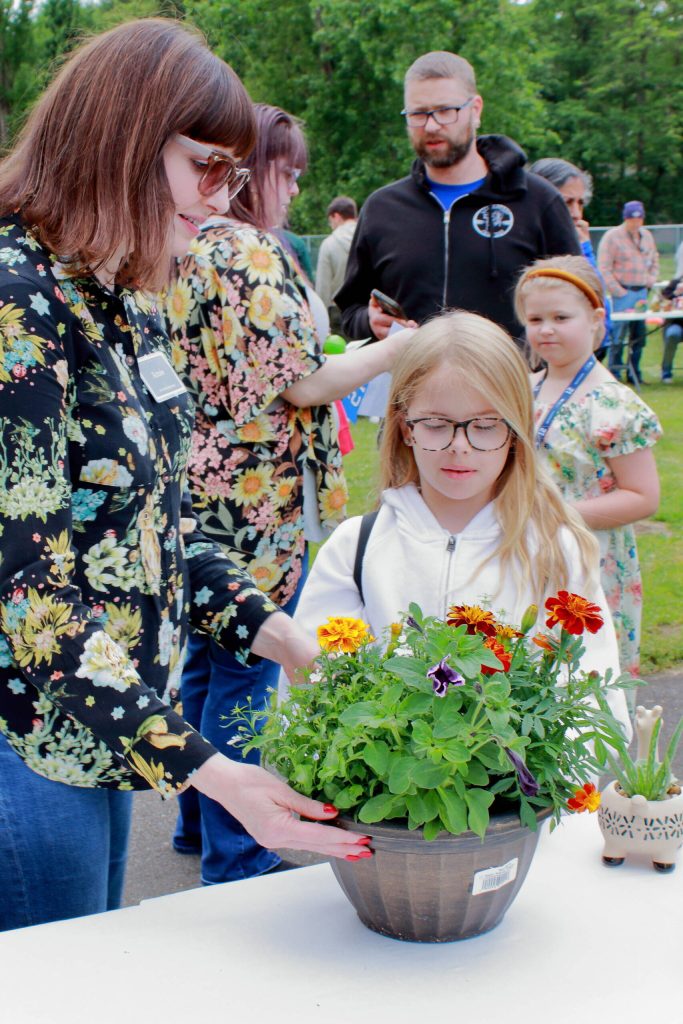 Youth and families got the chance to take home flower and vegetable plants and do a variety of fun activities at booths at the Twin Lakes Elementary community garden opening celebration.