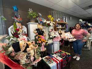 Malena Garces in her shop, Expresalo con Detalles, next to her gift baskets and flowers. The store is located at 1500 South 336th St. in Federal Way. Photo by Joshua Solorzano/The Mirror