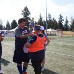John Emmett shares some positive words with goalie and team mate Nick King after their first game on Saturday, June 8.
