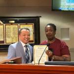 Federal Way City Councilmember Hoang V. Tran and Saudia Abdullah of the Diversity Commission hold the Juneteenth Proclamation. Photo by Joshua Solorzano/The Mirror