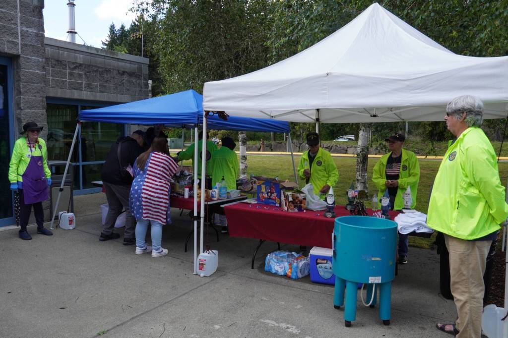 The Lions Club gives out hot dogs on Flag Day at the King County Aquatic Center. Photos By Joshua Solorzano/The Mirror