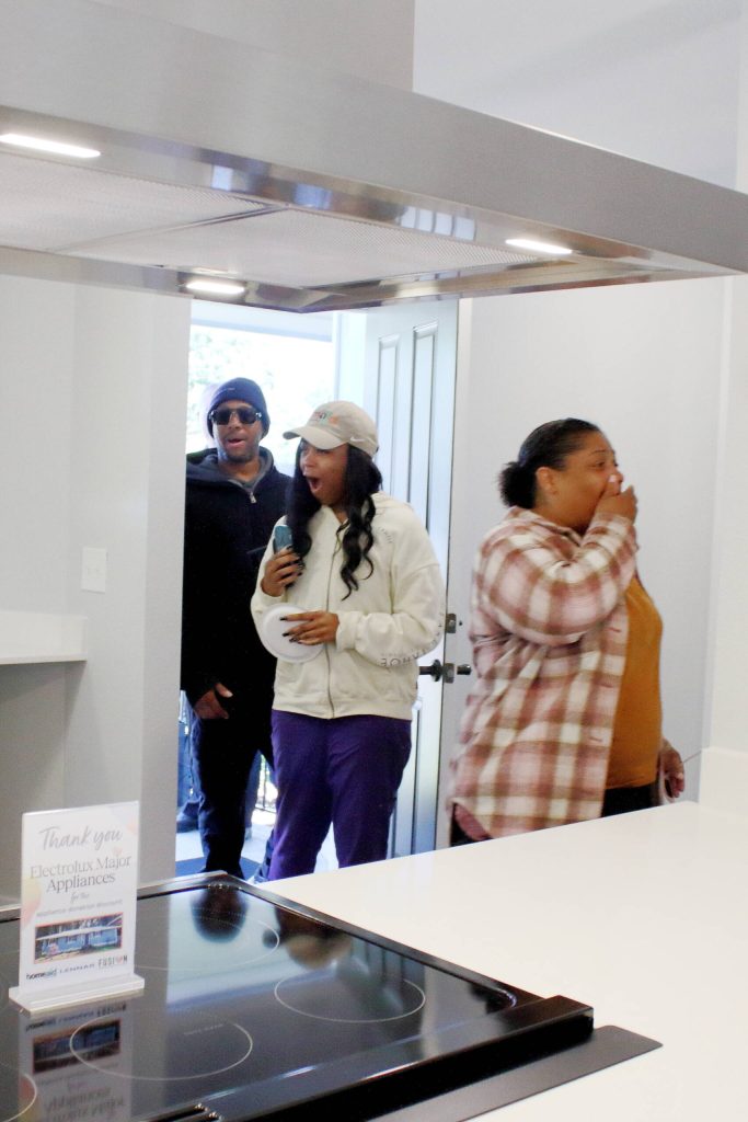 Keith and December see the newly remodeled Carpenter House for the first time. They will be the first members of FUSIONs transitional housing program to live there. Photo by Keelin Everly-Lang / The Mirror