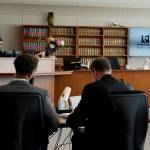 Robert Nelson III , sitting next to his lawyer in court while Judge Elizabeth J. Berns is in the background. Photo By Joshua Solorzano/The Mirror