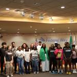 Attendees and kids gathered for a photo at the Progress Pushers civic engagement event. Photo by Mos Photography