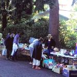 Tables stretched out under the trees to hold a variety of household items, distributed for free at the first free market. Photo provided by the Federal Way United Methodist Church