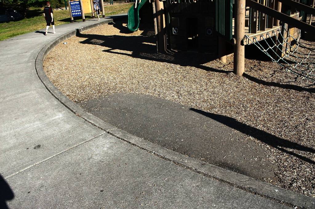 The main play area at Steel Lake Park has wood chips that arent accessible for kids or parents in wheelchairs or many with mobility issues, even if they could manage to get down this small ramp. Photo by Max Burchi/The Mirror