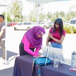 Guests fill out interest forms for a 200 hour training program for work in the solar industry through Sphere Solar Energy. Photo by Keelin Everly-Lang / the Mirror