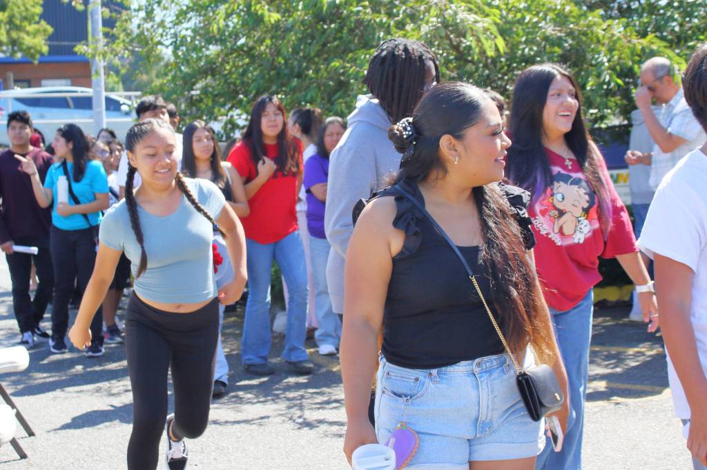 Youth involved in El Centro de la Raza programs head to the rink to skate after joining the ribbon cutting celebration for the new solar panels at the El Centro Skate Rink. Photo by Keelin Everly-Lang / the Mirror