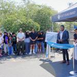 Edwin Wanji, Founder and CEO of Sphere Solar Energy, speaks at the ribbon cutting. Staff member Jessica Ramirez translated to make sure everyone could be part of the conversation. Photo by Keelin Everly-Lang / the Mirror