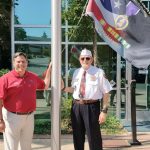 Federal Way Mayor Jim Ferrell and Roger Flygare with the Purple Heart flag as it was raising. Photo courtesy of Bill Vadino