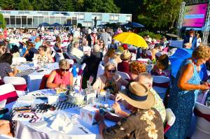 The lawn was packed with guests at FUSIONs Annual Gala - this year with an Alice in Wonderland theme and a new jumbotron screen to share their story throughout the night. Photo by Bruce Honda.