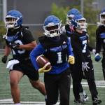 Zamarie Tellez leads a flock of Eagles after an interception during practice. Ben Ray / The Mirror