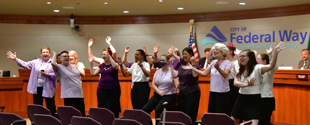 The Jet Cities Chorus performed a song at the start of the City Council meeting. Photo by Bruce Honda.