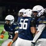Decatur defense celebrate a stop on fourth down against Enumclaw. Ben Ray / The Mirror