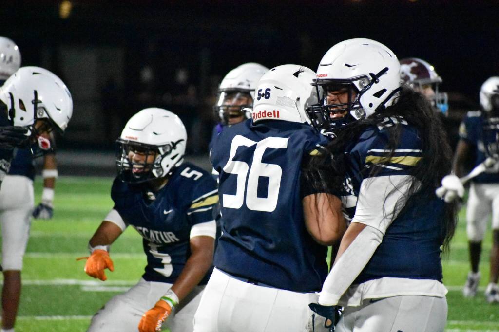 Decatur defense celebrate a stop on fourth down against Enumclaw. Ben Ray / The Mirror