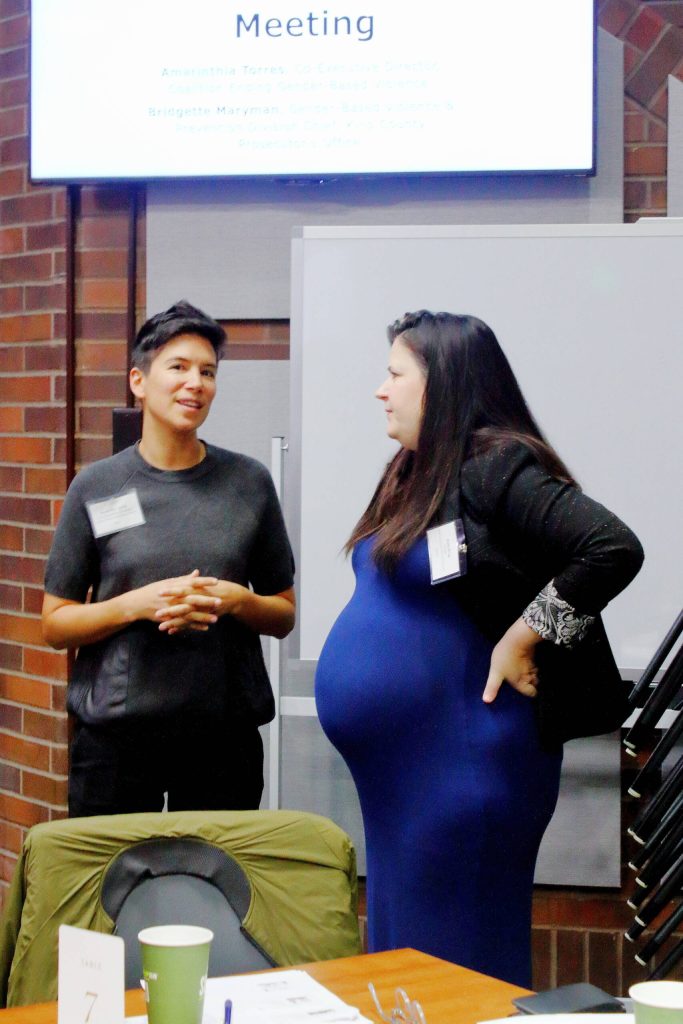 Amarinthia Torres (left) is the Co-Executive DIrector for the Coalition Ending Gender Based Violence. Here she speaks to another leader in DVI work at the South King County City Leaders Breakfast.