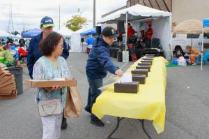 Guests voted for their favorite restaurant at The Taste of Federal Way in this photo from the 2023 event. The event concludes with awards given by judges as well as for Peoples Choice, based on votes dropped in these boxes throughout the day. File photo