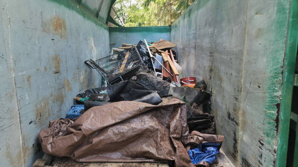 Trash was dragged a quarter mile out to the street where it was loaded up to be hauled away. Photo provided by Stand Up Federal Way Community.