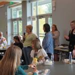 Federal Way Senior Commission member Debbie Harvey introducing the speakers from Premier Insurance. Photo by Joshua Solorzano/The Mirror