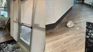 The front entrance of Twin Lakes Veterinary Hospital and the rock that did the damage. (Photo courtesy of FWPD)