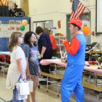 A local apprentice plumber dressed up as one of the most famous fictional plumbers of all time - Super Mario - at the Adelaide career fair to get kids excited about the career.