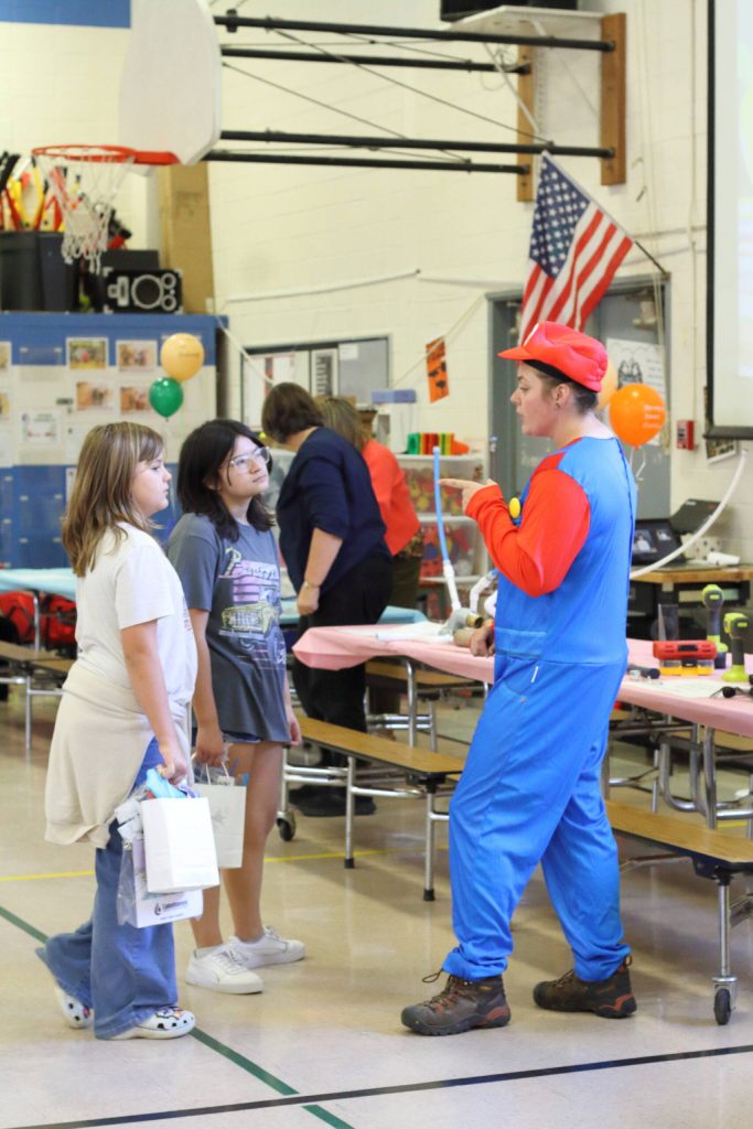 A local apprentice plumber dressed up as one of the most famous fictional plumbers of all time - Super Mario - at the Adelaide career fair to get kids excited about the career.